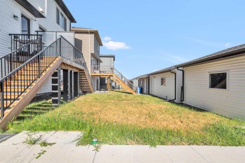 52 Edith Gate Nw, Calgary, AB - Outdoor With Deck Patio Veranda With Exterior