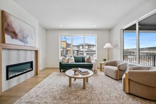 28 Sunvalley View, Cochrane, AB - Indoor Photo Showing Living Room With Fireplace