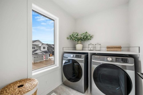 28 Sunvalley View, Cochrane, AB - Indoor Photo Showing Laundry Room