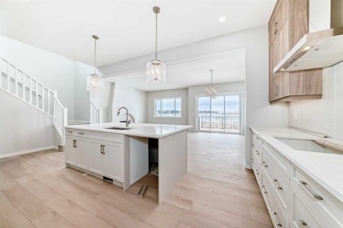 203 Langwell Common Se, Airdrie, AB - Indoor Photo Showing Kitchen With Upgraded Kitchen