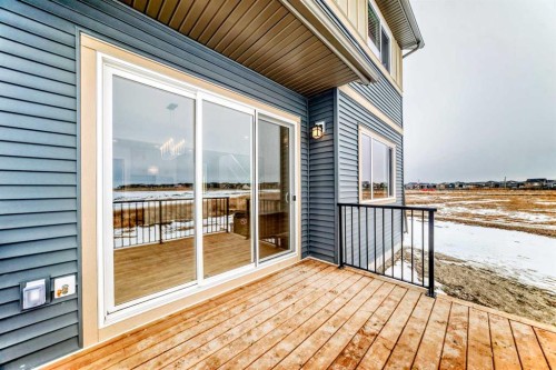 203 Langwell Common Se, Airdrie, AB - Outdoor With Deck Patio Veranda