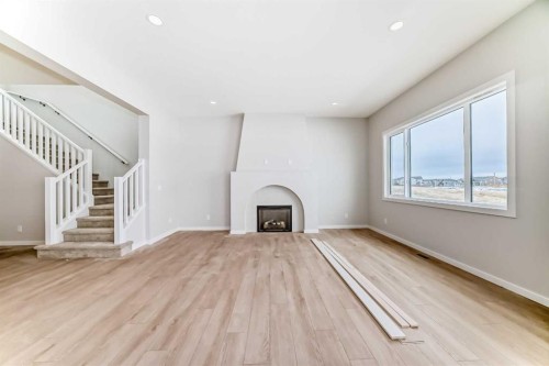 203 Langwell Common Se, Airdrie, AB - Indoor With Fireplace