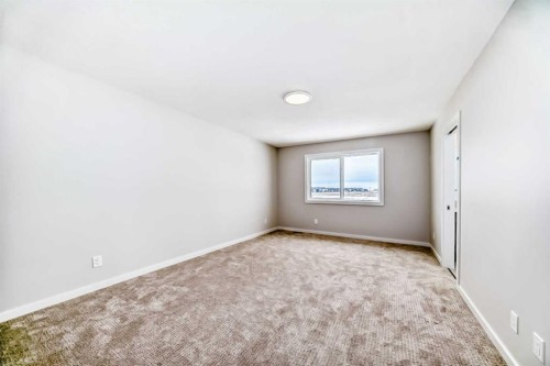 203 Langwell Common Se, Airdrie, AB - Indoor Photo Showing Other Room