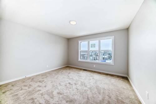 203 Langwell Common Se, Airdrie, AB - Indoor Photo Showing Other Room