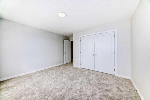 203 Langwell Common Se, Airdrie, AB - Indoor Photo Showing Other Room