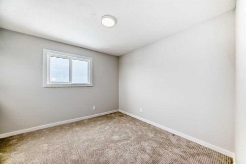 203 Langwell Common Se, Airdrie, AB - Indoor Photo Showing Other Room