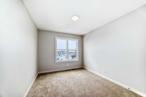203 Langwell Common Se, Airdrie, AB - Indoor Photo Showing Other Room