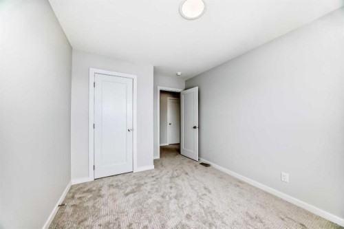 203 Langwell Common Se, Airdrie, AB - Indoor Photo Showing Other Room