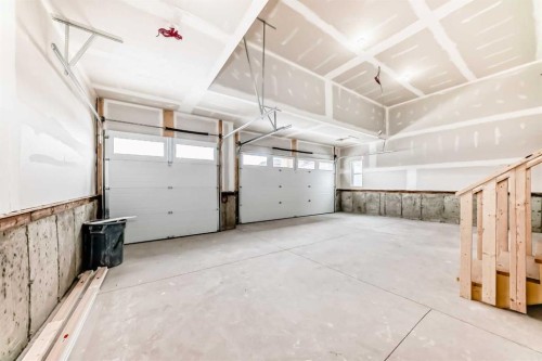 203 Langwell Common Se, Airdrie, AB - Indoor Photo Showing Garage