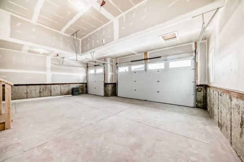 203 Langwell Common Se, Airdrie, AB - Indoor Photo Showing Garage