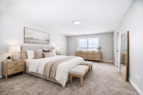 203 Langwell Common Se, Airdrie, AB - Indoor Photo Showing Bedroom