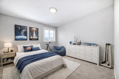 203 Langwell Common Se, Airdrie, AB - Indoor Photo Showing Bedroom