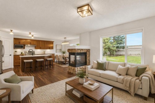 331 Springbank Place Sw, Calgary, AB - Indoor Photo Showing Living Room With Fireplace