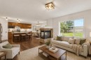 331 Springbank Place Sw, Calgary, AB  - Indoor Photo Showing Living Room With Fireplace 