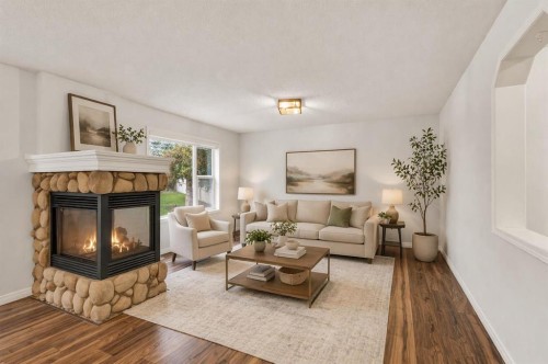 331 Springbank Place Sw, Calgary, AB - Indoor Photo Showing Living Room With Fireplace