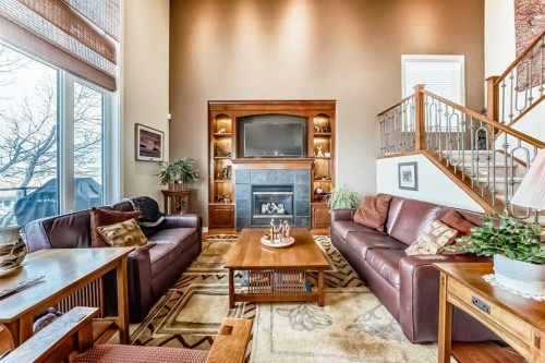 487 Rocky Ridge Drive Nw, Calgary, AB - Indoor Photo Showing Living Room With Fireplace