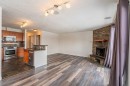 135 27 Avenue Ne, Calgary, AB  - Indoor Photo Showing Kitchen With Fireplace 