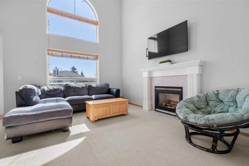 136 Coral Springs Landing Ne, Calgary, AB - Indoor Photo Showing Living Room With Fireplace