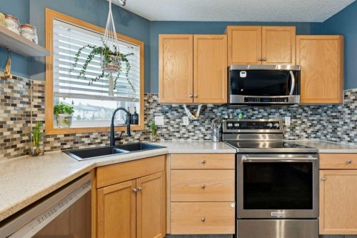 515 Stonegate Road Nw, Airdrie, AB - Indoor Photo Showing Kitchen With Double Sink