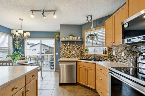 515 Stonegate Road Nw, Airdrie, AB - Indoor Photo Showing Kitchen With Double Sink