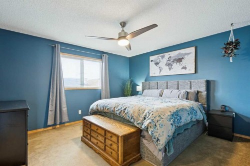 515 Stonegate Road Nw, Airdrie, AB - Indoor Photo Showing Bedroom