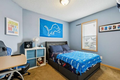 515 Stonegate Road Nw, Airdrie, AB - Indoor Photo Showing Bedroom