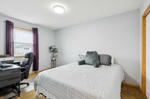 515 Stonegate Road Nw, Airdrie, AB - Indoor Photo Showing Bedroom