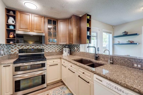 103 Riverview Circle Se, Calgary, AB - Indoor Photo Showing Kitchen With Double Sink