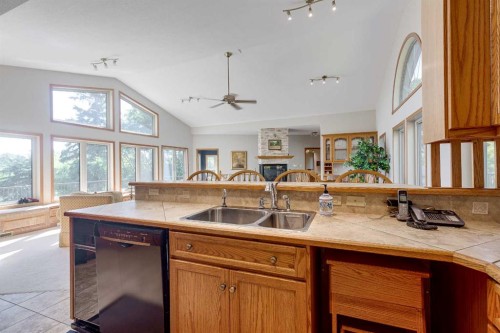602 Pheasant Close, Pelican Point, AB - Indoor Photo Showing Kitchen With Double Sink