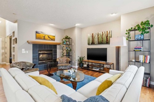 11 Wentworth Manor Sw, Calgary, AB - Indoor Photo Showing Living Room With Fireplace