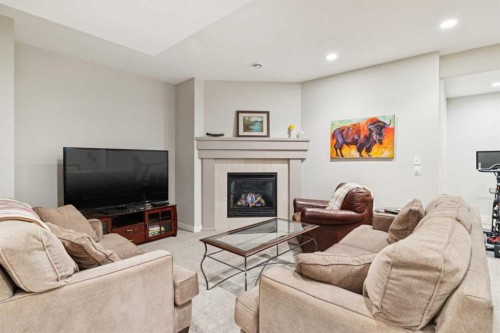 11 Wentworth Manor Sw, Calgary, AB - Indoor Photo Showing Living Room With Fireplace