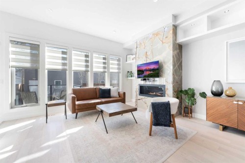 231 12 Avenue Ne, Calgary, AB - Indoor Photo Showing Other Room With Fireplace