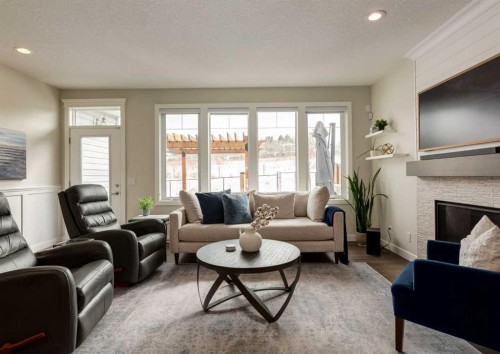 60 Crestbrook View Sw, Calgary, AB - Indoor Photo Showing Living Room With Fireplace
