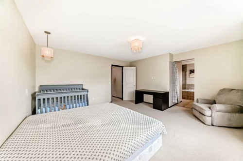 691 Panamount Boulevard Nw, Calgary, AB - Indoor Photo Showing Bedroom