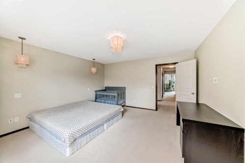691 Panamount Boulevard Nw, Calgary, AB - Indoor Photo Showing Bedroom