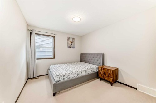 691 Panamount Boulevard Nw, Calgary, AB - Indoor Photo Showing Bedroom