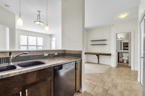 415-26 Val Gardena View Sw, Calgary, AB - Indoor Photo Showing Kitchen With Double Sink