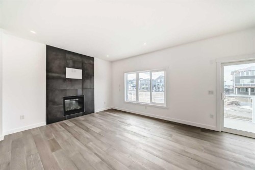 267 Chelsea Heath, Chestermere, AB - Indoor Photo Showing Living Room With Fireplace