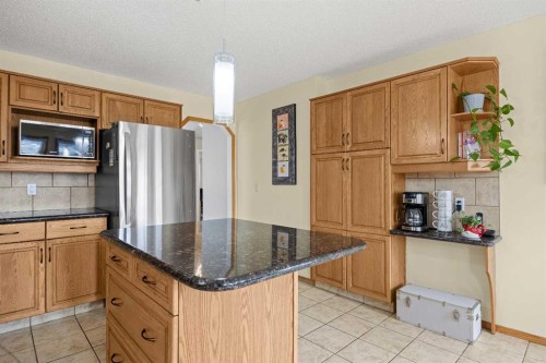 1331 Sunvista Way Se, Calgary, AB - Indoor Photo Showing Kitchen