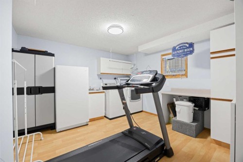 1331 Sunvista Way Se, Calgary, AB - Indoor Photo Showing Gym Room
