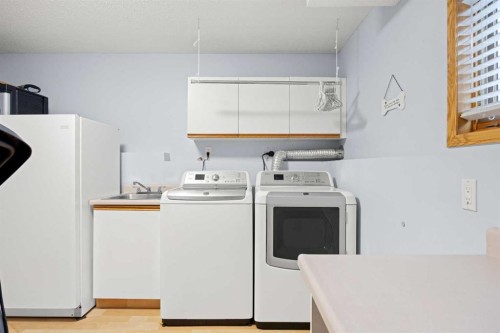 1331 Sunvista Way Se, Calgary, AB - Indoor Photo Showing Laundry Room