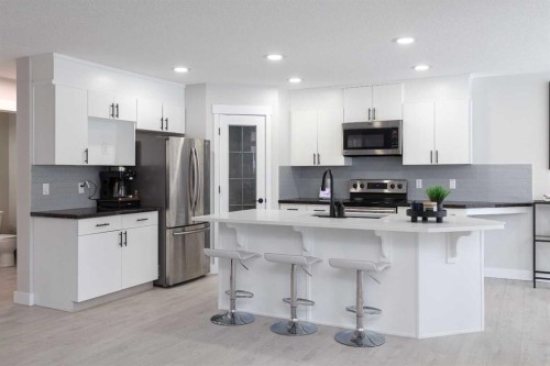 86 Cougarstone Court Sw, Calgary, AB - Indoor Photo Showing Kitchen With Upgraded Kitchen