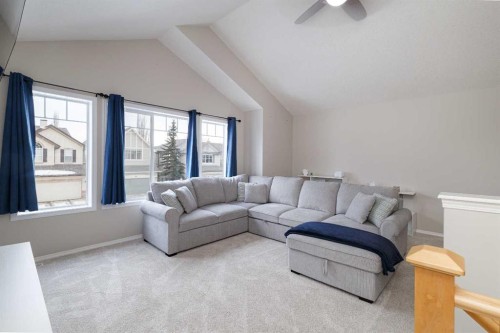 86 Cougarstone Court Sw, Calgary, AB - Indoor Photo Showing Living Room