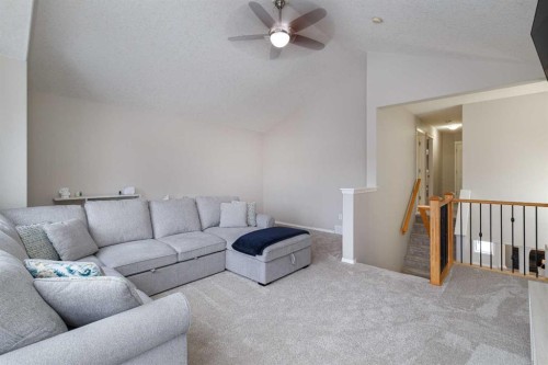86 Cougarstone Court Sw, Calgary, AB - Indoor Photo Showing Living Room
