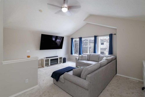 86 Cougarstone Court Sw, Calgary, AB - Indoor Photo Showing Living Room