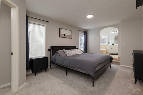 86 Cougarstone Court Sw, Calgary, AB - Indoor Photo Showing Bedroom