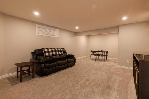 86 Cougarstone Court Sw, Calgary, AB - Indoor Photo Showing Basement