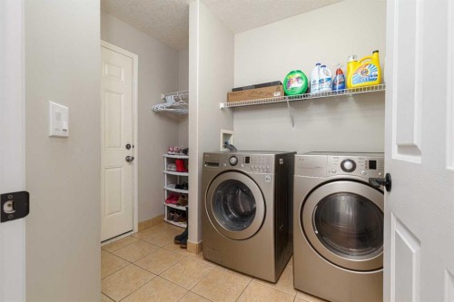 86 Cougarstone Court Sw, Calgary, AB - Indoor Photo Showing Laundry Room