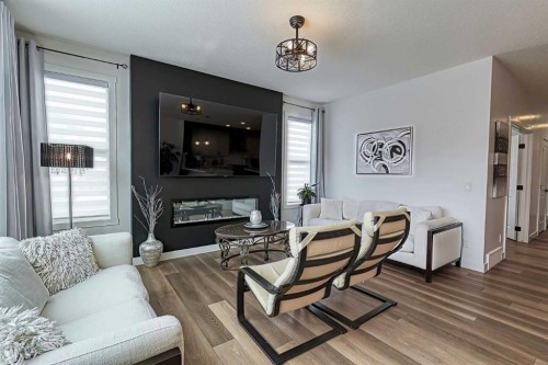 3 Saddlebred Court, Cochrane, AB - Indoor Photo Showing Living Room With Fireplace