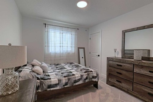 3 Saddlebred Court, Cochrane, AB - Indoor Photo Showing Bedroom